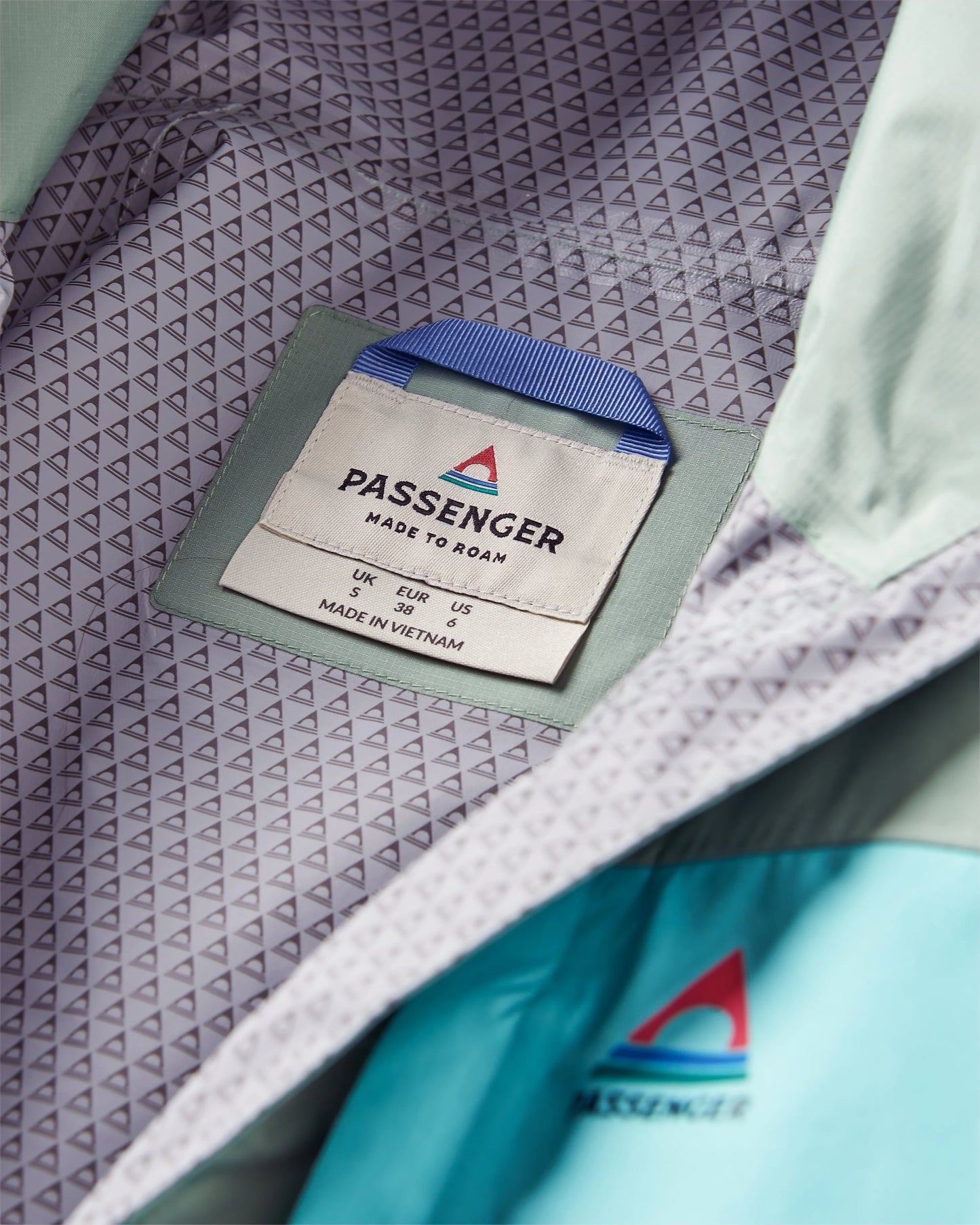 Trailscape Women's Recycled Waterproof Jacket - Pistachio/Lilac Mist/Aqua - Flatlay