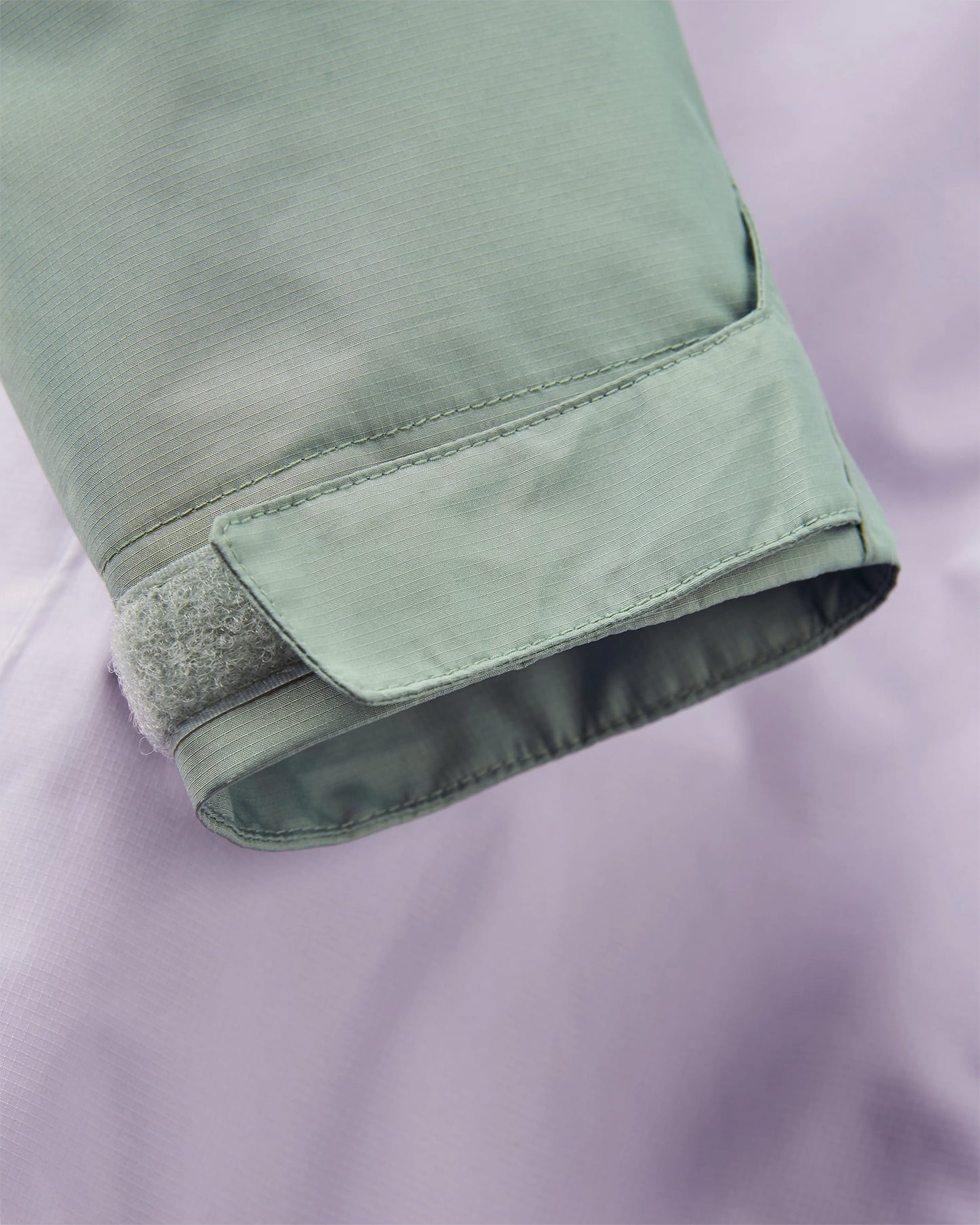 Trailscape Women's Recycled Waterproof Jacket - Pistachio/Lilac Mist/Aqua - Flatlay