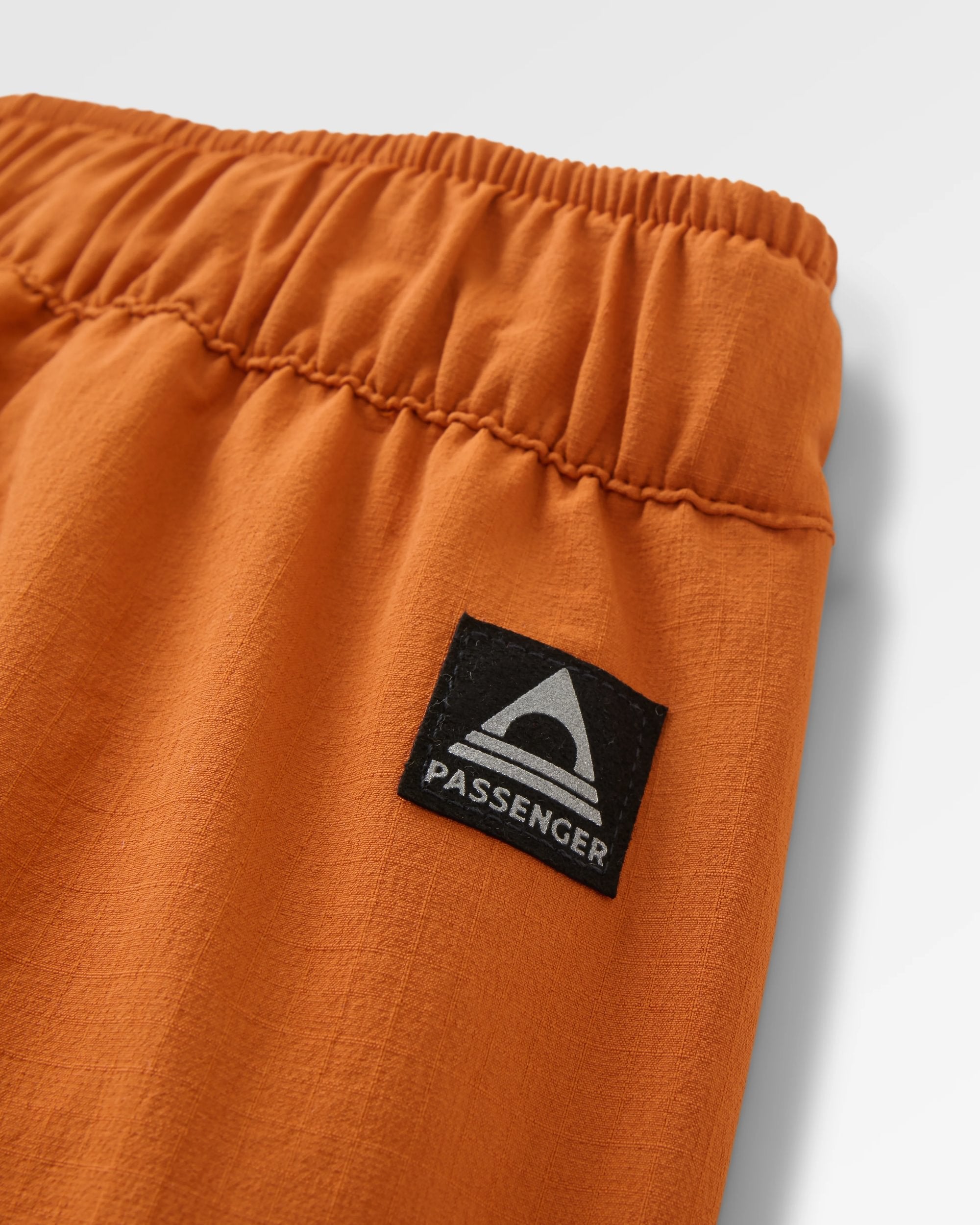 Sandstone Recycled Active Trail Short - Sunset Orange - Flatlay