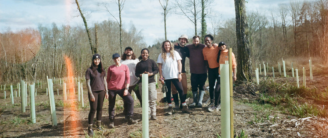 A group photo in a forest clearing