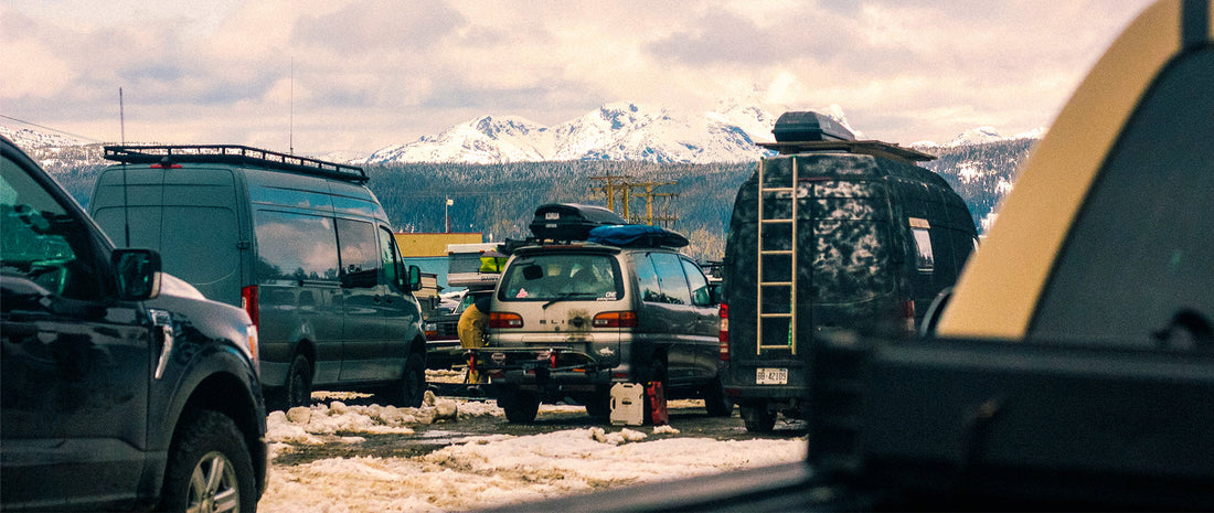 A car park in the mountains, vans parked up