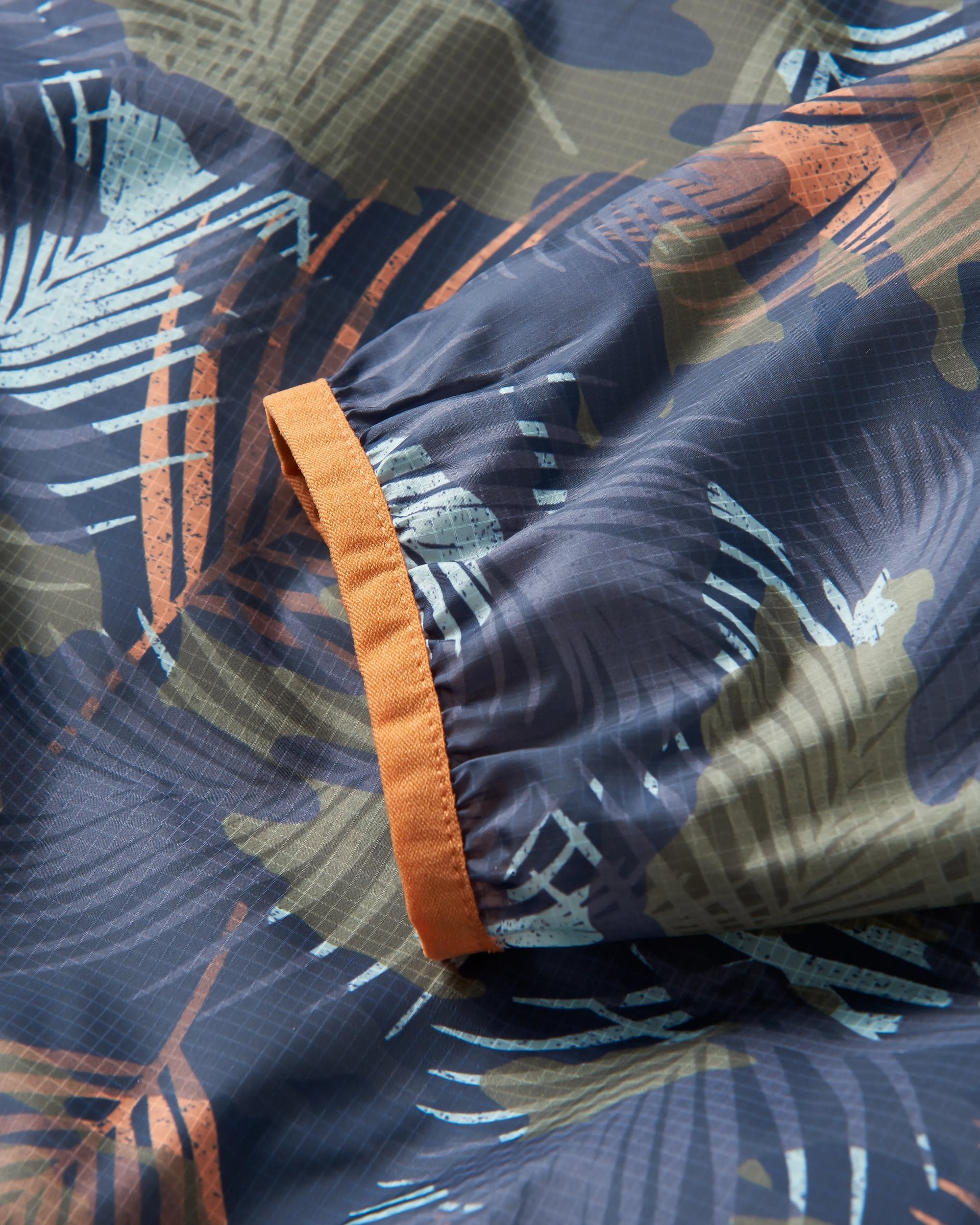 Gusto Recycled Windshell Anorak - Palm Camo Apricot - Flatlay